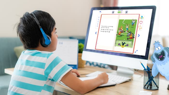 Young child listening to one of the read-aloud books in Reading Eggs