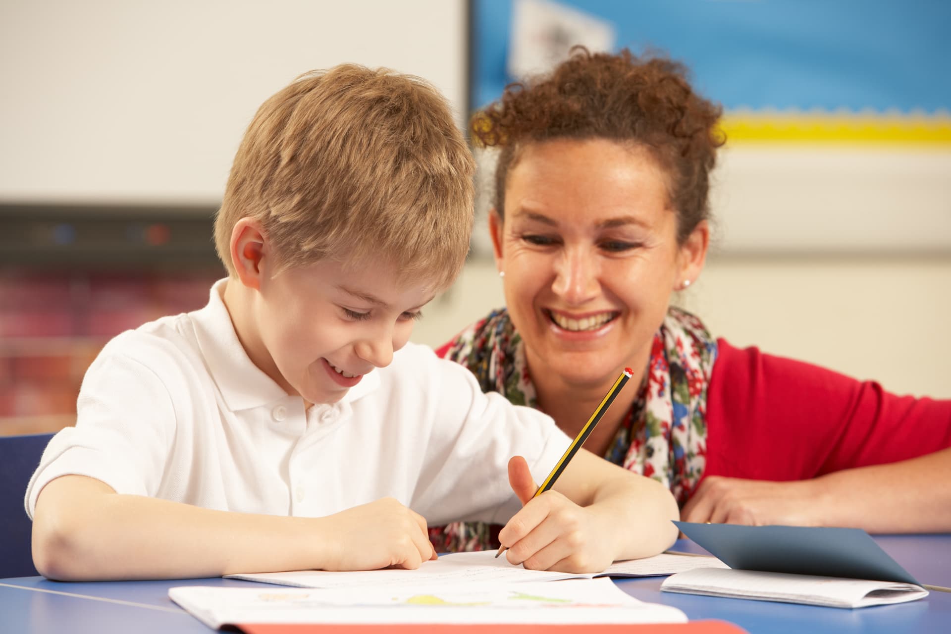 Teacher helping a student understand a lesson