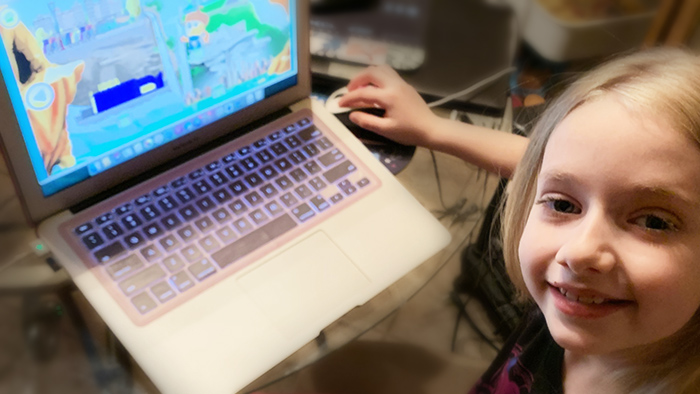 Seven year old school girl with ADHD learning with Reading Eggs online program.