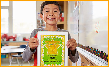 Student holding up Reading Eggs certificate