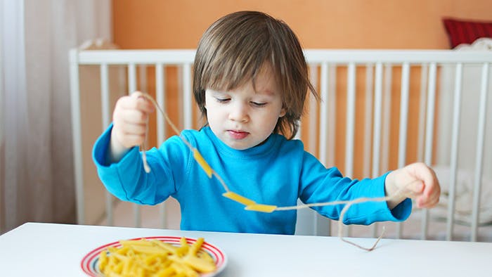 Preschooler math activity with macaroni