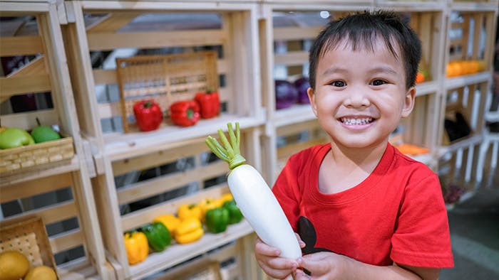 preschool child plays shop for math activity