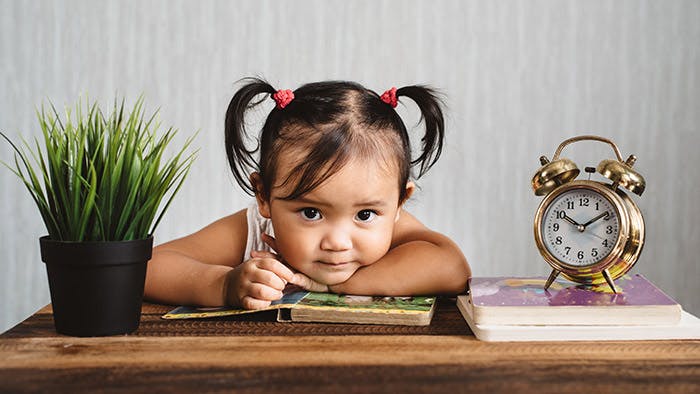 Toddler reading an early reader book