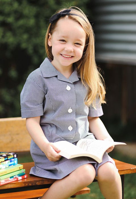 Kindergarten child enjoying learning to read.