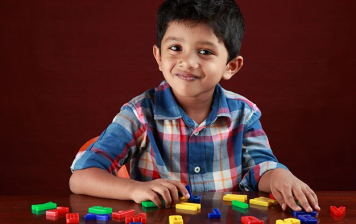 Image of boy phonics with alphabet letters